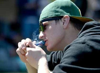 http://en.amwalalghad.com/images/stories/Politics/2014/man-smokes-marijuana-reuters.jpg