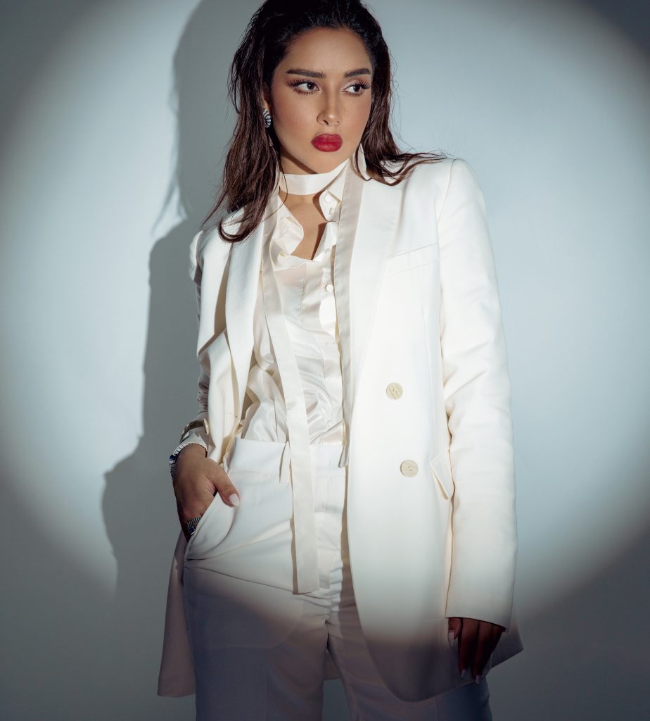 Balqees Fathi in an all-white ensemble by Maison Valentino
