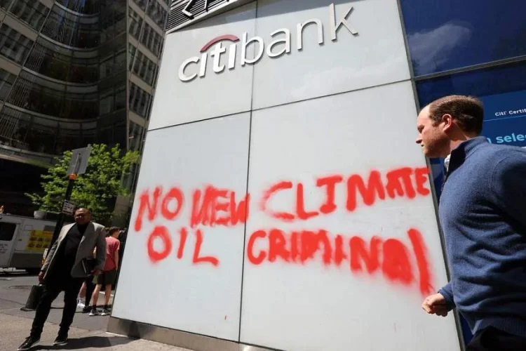 Citibank's office with "No New Oil", "Climate Criminal" written on the wall