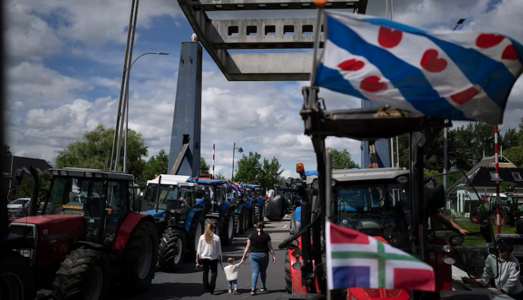 Tractors from protesting farmers block a draw bridge preventing ships from passing