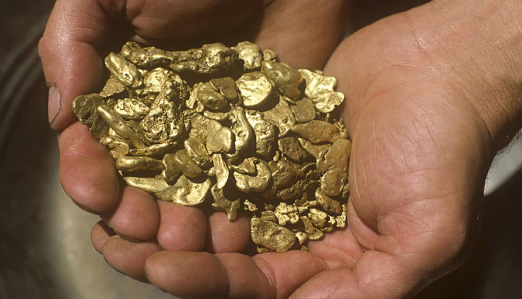 Mined gold held in man's hands