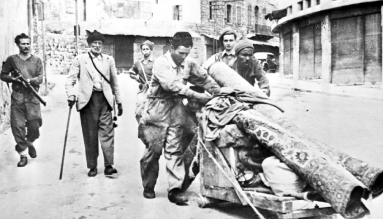 Palestinians being expelled from their homes in Haifa by the forerunner of the Israeli army in April 1948