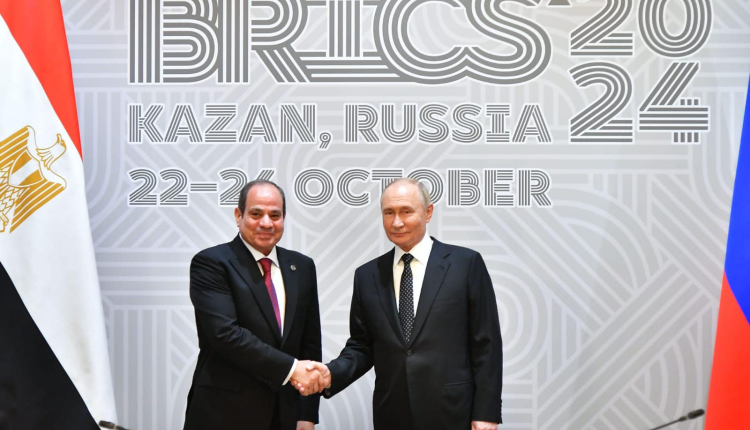 Egypt President Abdel Fattah El Sisi (L) shaking hands with Russian President Vladimir Putin upon arrival on Tuesday in Kazan, Russia to participate in the BRICS Summit.